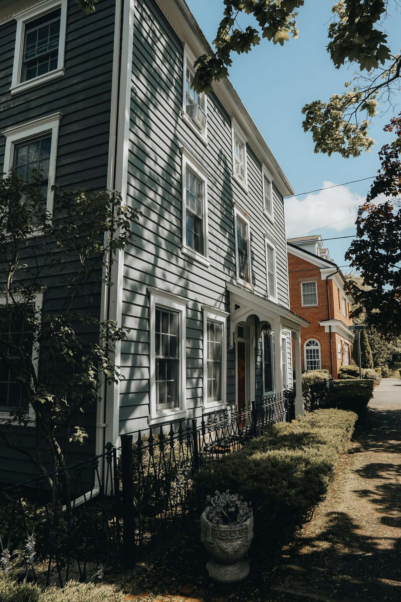 Street of historic houses with gray and white wood siding