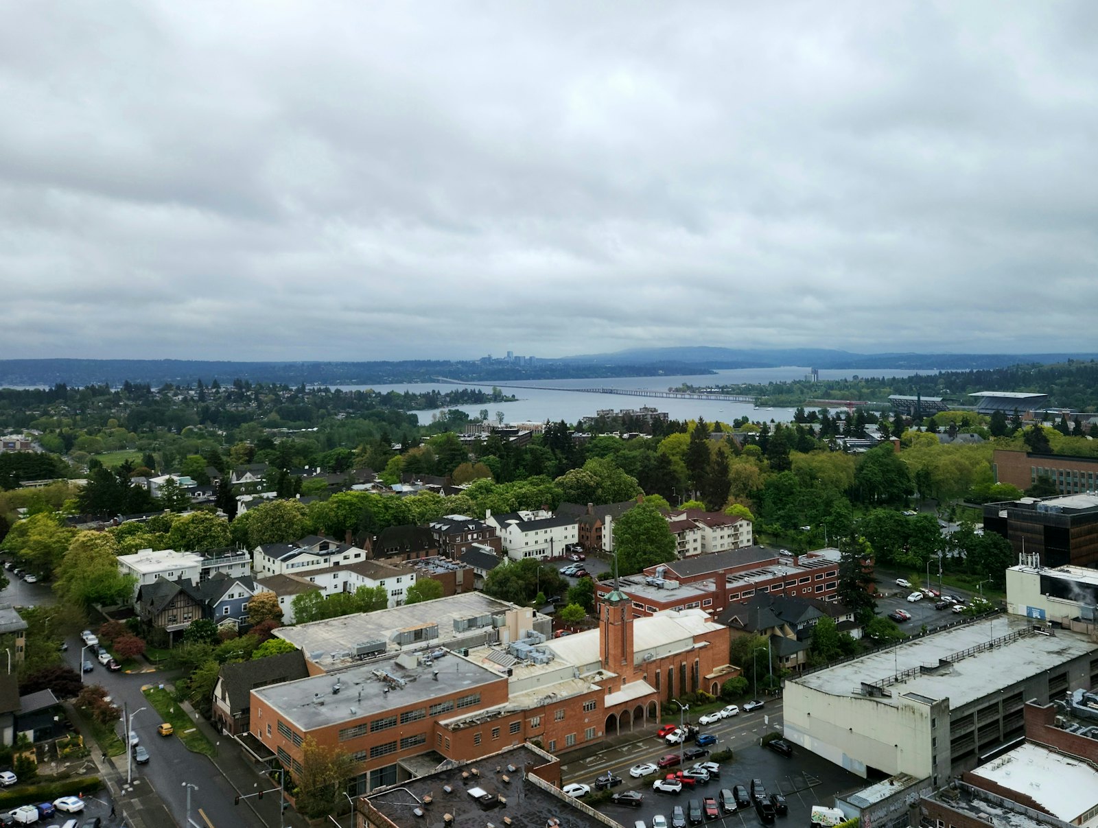Aerial view of a city neighborhood with a lake in the background